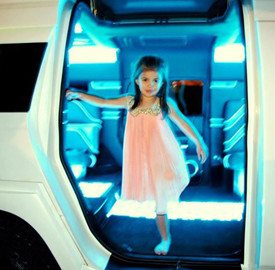 A child in a limo.