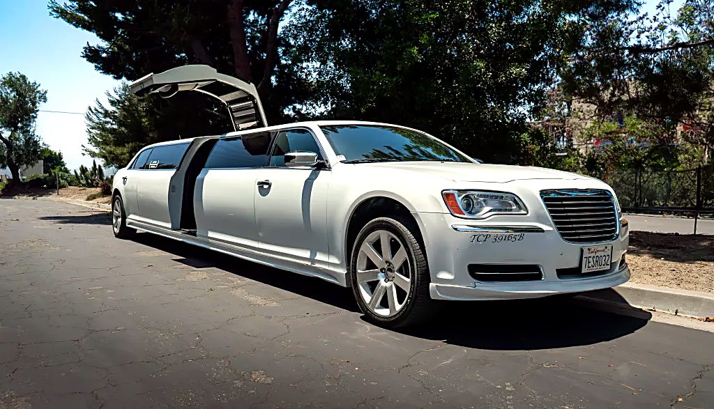 White Chrysler 300 jet door limousine, daytime
