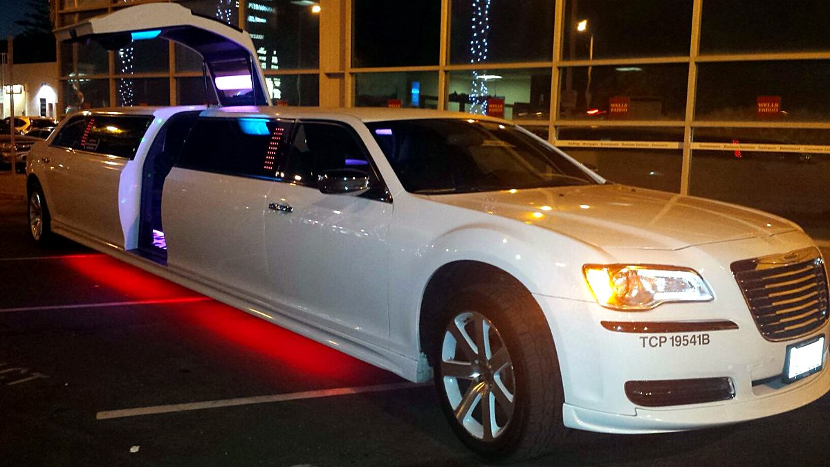 Chrysler 300 jet door limo at night with red underglow