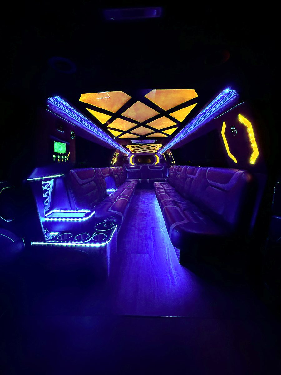 2024 Escalade with doors open and glowing entry lighting