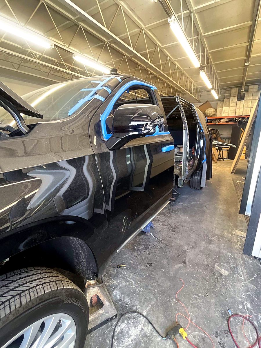 The 2024 Escalade donor body separated for stretching, cut line taped