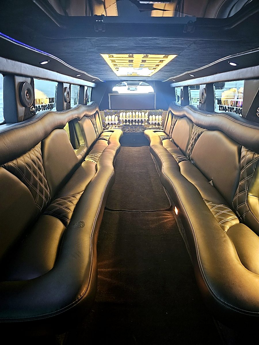 Hummer H2 stretch interior in warm gold lighting
