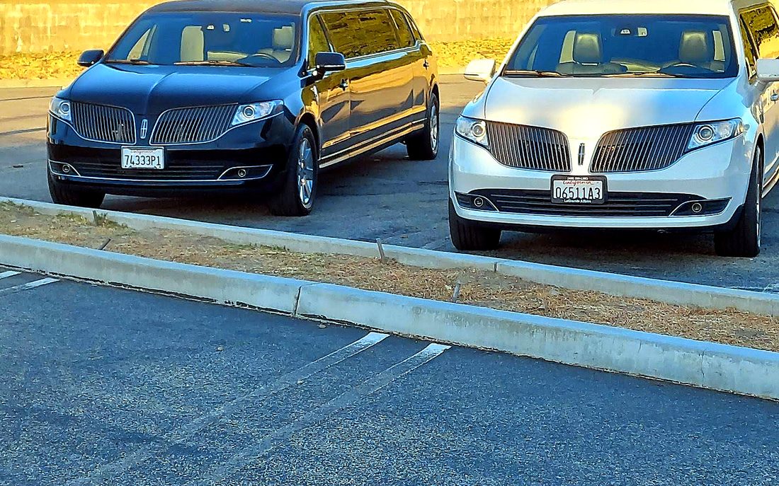 Black and white Lincoln MKT stretch limousines