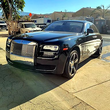 Black Rolls-Royce Ghost, front three-quarter view
