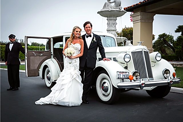 1937 Packard with wedding couple and chauffeur