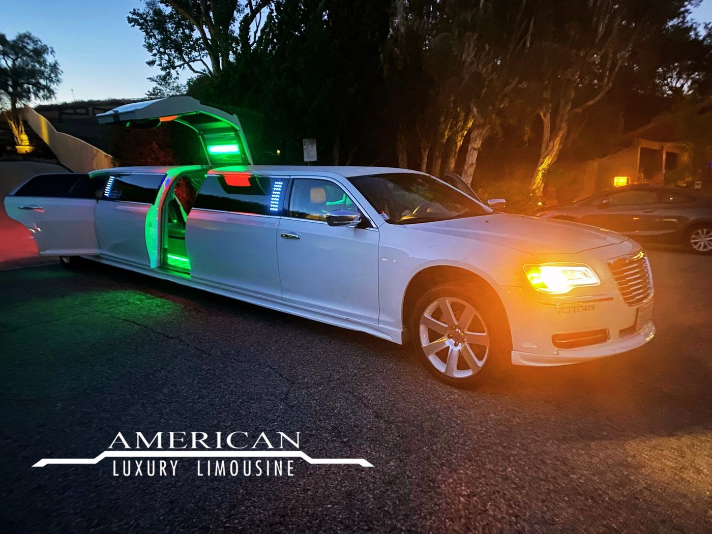 Chrysler 300 jet-door stretch limo at night for homecoming