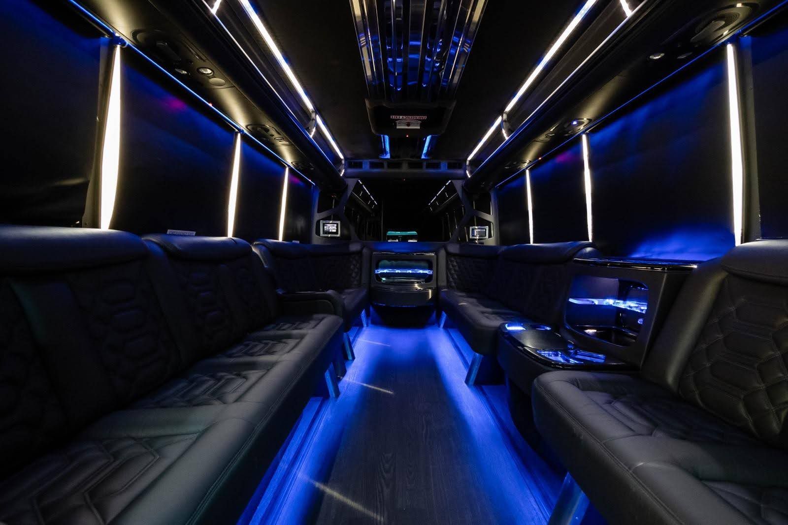 Party bus interior glowing with blue LED lighting for a Christmas lights tour